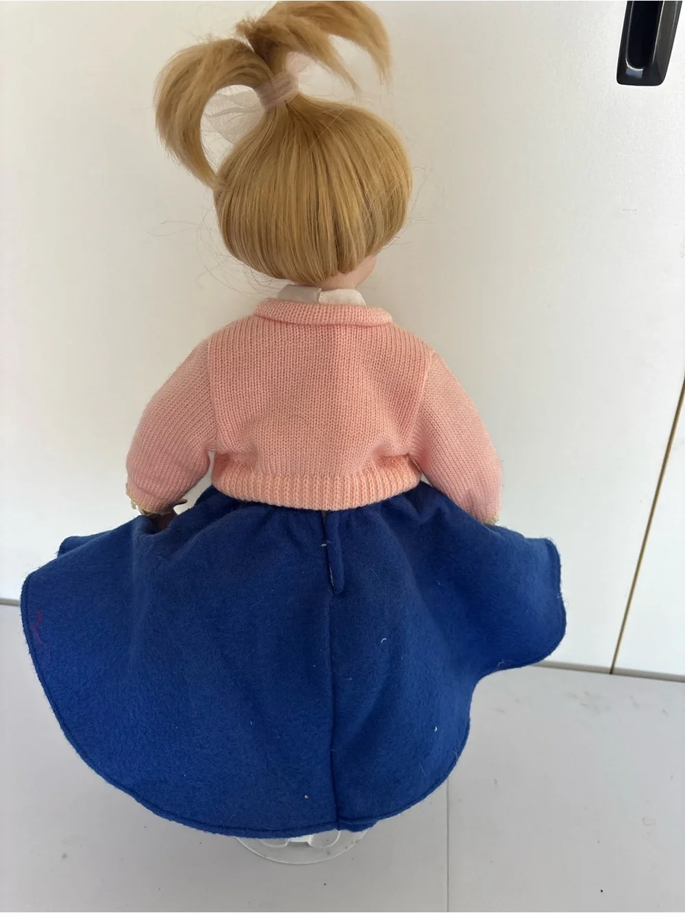 Porcelain Blonde Doll in Pink Cardigan and Blue Skirt